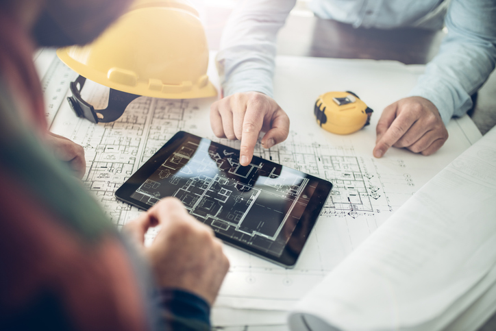 Pre-construction, tablet on table of demolition contractor