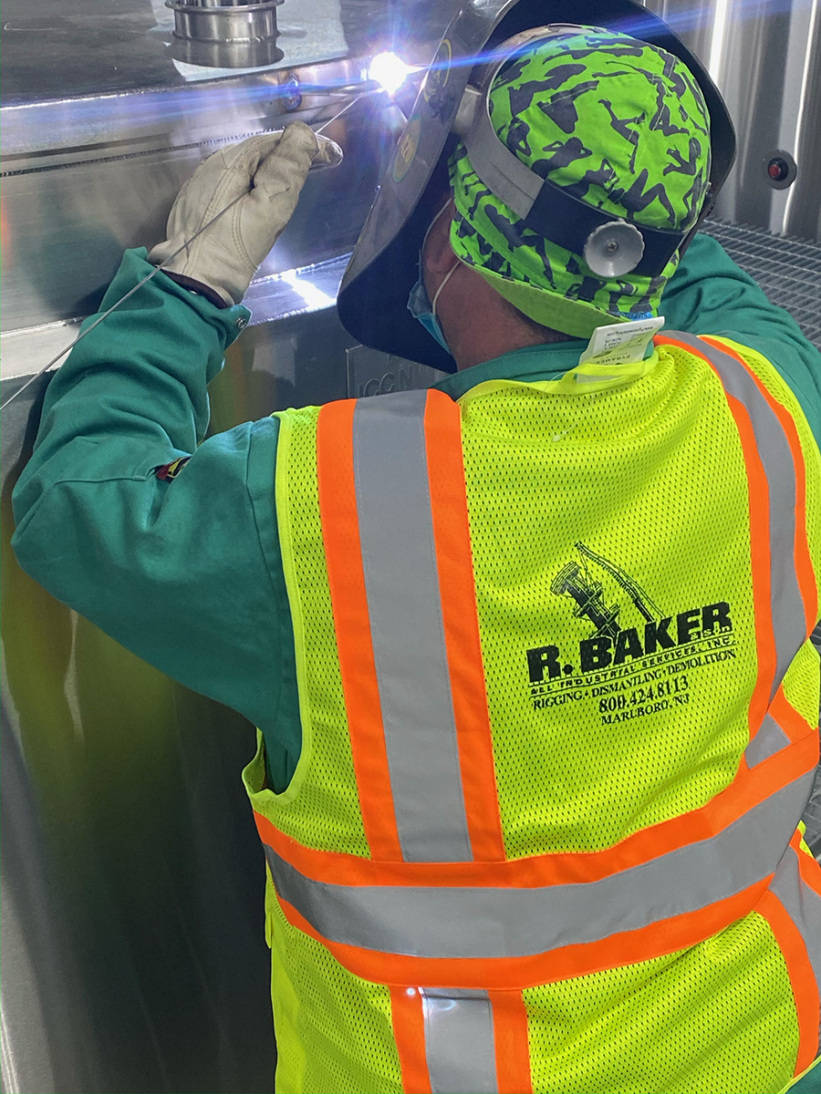 construction worker performing a multi heat exchanger changeoutÂ 