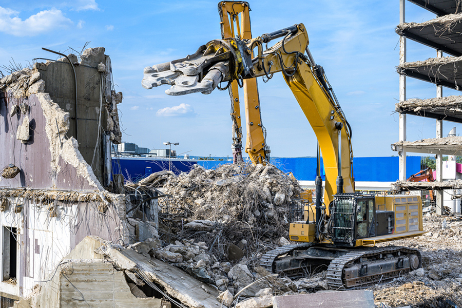 excavator at demolition site, questions about demolition contracting