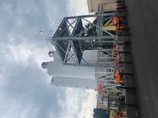 Heavy equipment rigging during the installation of a new grain silo and processing system by R Baker.