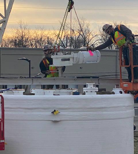 Rigging, completely assembling, and setting 12 large fiberglass cylindrical tanks, each with a 17,000-gallon capacity.