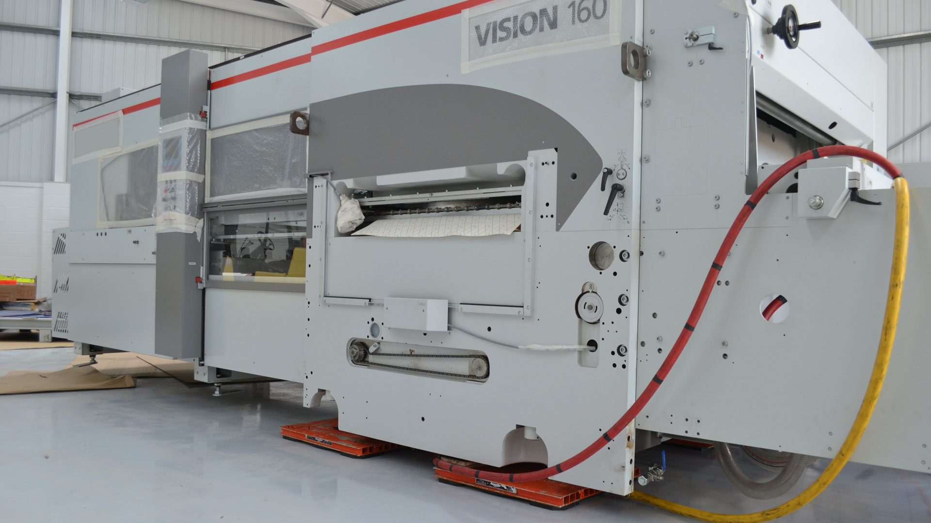 Air skates (air casters) lifting and moving multi-ton industrial equipment using compressed air in a plant relocation project