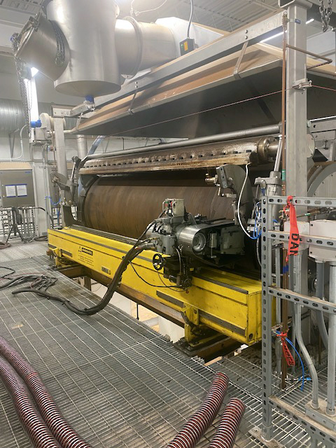 The finishing beam used in the process weighed 2,600 lbs and had to be perfectly parallel and level to the drum it was refinishing, both within less than 1/64 of an inch. 