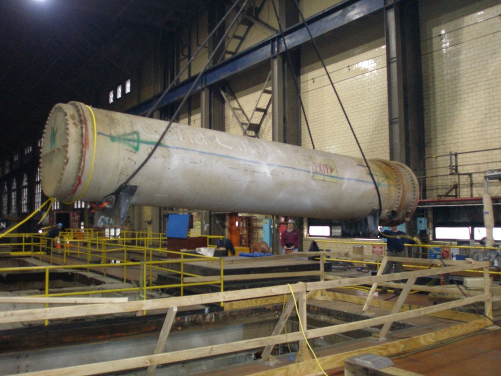 Photo Of Large Dismantled Machinery Being Rigged Out Of Power Pl