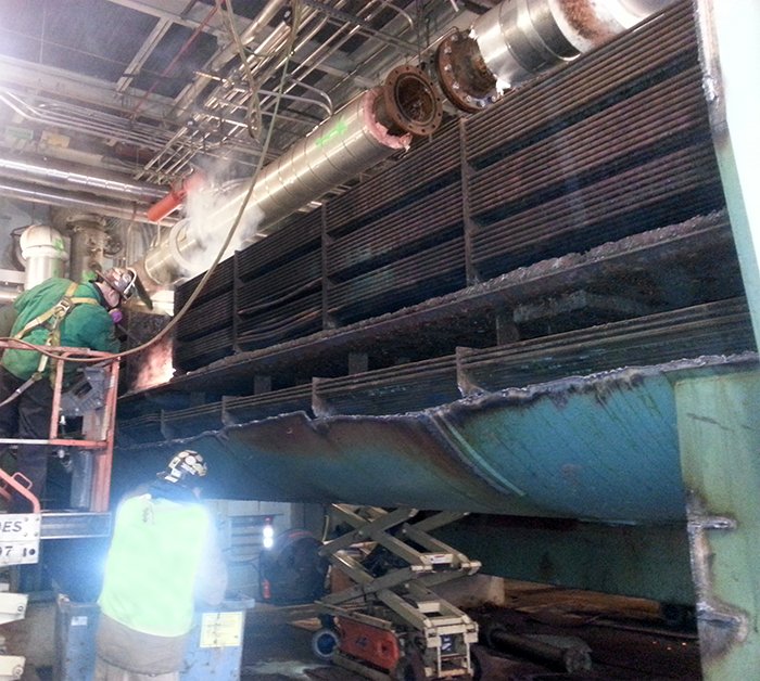 two workers during boiler demolition